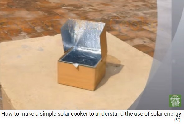 La caja
                          solar est� de pie al sol con un panel de
                          vidrio y un reflector