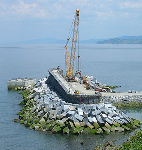 Protection dike with wave power plant under
                        construction 02