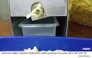 Side view of the oil
                mill with pomace and oil droping into the oil bowl