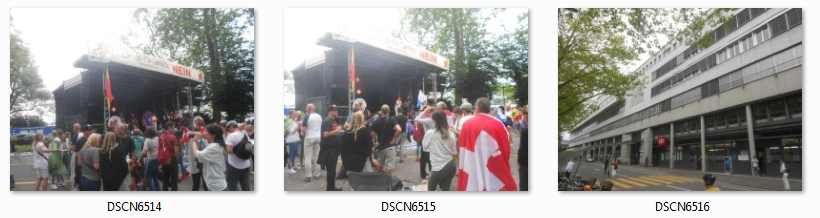 Demonstration f�r Grundrechte Luzern
                      31.7.2021: Sammelfoto 7: Rednerpodium und
                      gegen�ber das Schweizer MoSSad-Fernsehen SRF