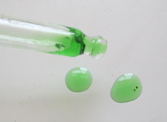 Cannabis oil from a pipette, 2 drops