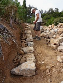 Two-line dry-stone wall on
                                    the slope, the foundation and the
                                    foundation stones, without gravel
                                    bed