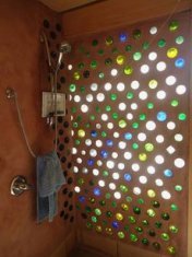 Interior wall with
                    bottle pattern in white, blue, green and yellow