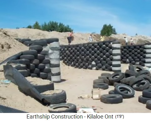 Killaloe, earthship
                                  construction 03: tire-earth walls are
                                  stabilized a little bit with concrete,
                                  side area