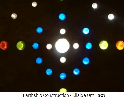 Killaloe, earthship
                                  construction 29: Bottle pattern in an
                                  interior wall, view from the insight,
                                  lightening