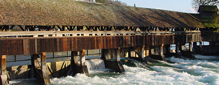 Thun
                  (Switzerland): This weir was blocking the driftwood so
                  the fast going down of the flood was blocked. Only a
                  helicopter operation taking out the wood by air could
                  solve the situation.