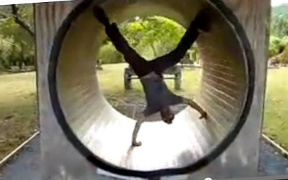 Hamster wheel 04,
                            acrobat headlong in the hamster wheel at
                            Water Works near Coromandel in New Zealand