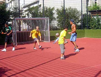 Fenced soccer field for children
                                and youths with metal goals,
                                Blaub�rplatz (Blue Bear Square) in
                                Berlin-Neukoelln
